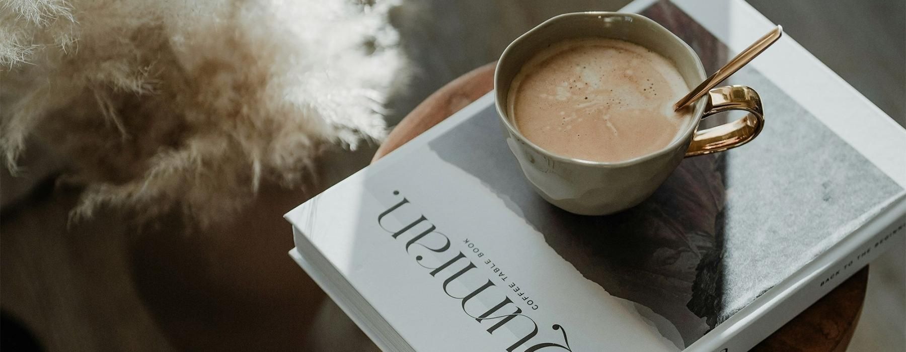 Elegance everywhere you look a cup of coffee on a book